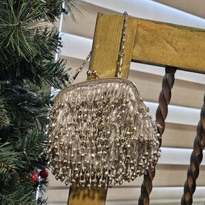 Embellished tassel silver clutch bag